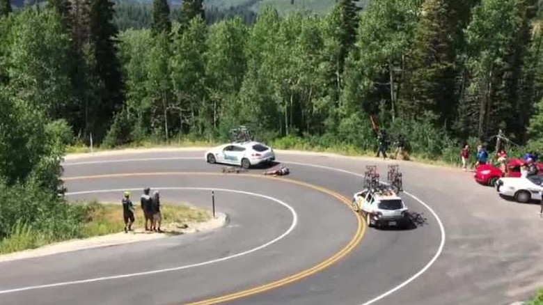 Cyclist Racing Downhill Crashes Into Car Cyclist Racing Downhill Crashes Into Car