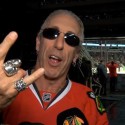 Twisted Sister frontman Dee Snider shoots the puck at Blackhawks game
