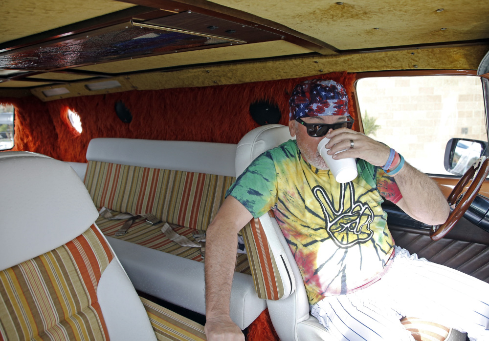 Chicago Cubs manager Joe Maddon sits in his van before a practice session Monday, Feb. 29, 2016 when this image was taken. (AP Photo/Morry Gash) ORG XMIT: AZMG101